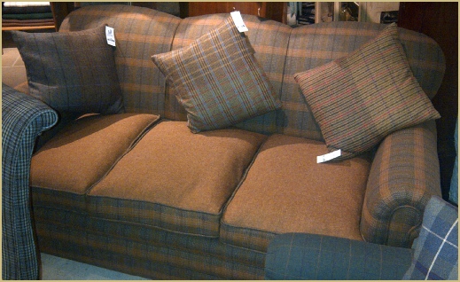 Magnificent three seater sofa covered in a Pure New Wool twist Saxony with contrasting milled Shetland cushions